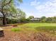 Spacious backyard with mature trees, grass and a firepit provides ample space for outdoor activities and relaxation at 10862 Albion Dr, Thornton, CO 80233