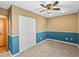 Charming bedroom showcasing wainscoting, neutral walls, and a spacious closet for storage at 10862 Albion Dr, Thornton, CO 80233