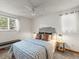 Comfortable bedroom showcasing a bed, windows providing natural light, and stylish decor at 10862 Albion Dr, Thornton, CO 80233