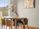 Dining area features contemporary furnishings and decor, with a door to the yard at 10862 Albion Dr, Thornton, CO 80233