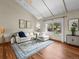 Sun-filled living room boasts vaulted ceilings, contemporary decor, and large windows at 10862 Albion Dr, Thornton, CO 80233