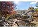 Beautiful backyard with a water feature, a patio seating area, and mature landscaping at 4 Arabian Pl, Littleton, CO 80123