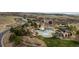 Scenic aerial view showcases the community clubhouse, pools and lush landscape at 10553 Fairhurst Way, Highlands Ranch, CO 80126