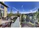 Well-appointed deck with dining and seating areas, plus lovely garden views at 10553 Fairhurst Way, Highlands Ranch, CO 80126