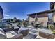 Spacious deck with wicker furniture and dining set, ideal for outdoor entertaining at 10553 Fairhurst Way, Highlands Ranch, CO 80126