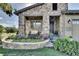 Inviting stone accented front porch and front yard with a colorful garden and lush lawn at 10553 Fairhurst Way, Highlands Ranch, CO 80126