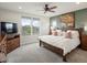 Comfortable main bedroom featuring a wooden bed frame, and a large painting at 10553 Fairhurst Way, Highlands Ranch, CO 80126