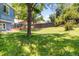 Enjoy this expansive backyard featuring lush grass, mature trees, and ample space for outdoor activities and relaxation at 12175 Birch St, Thornton, CO 80241