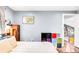 Bedroom showing storage and comfortable decor next to the bright upstairs hallway at 12175 Birch St, Thornton, CO 80241
