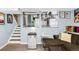 This cozy living area, adjacent to the kitchen, is perfect for relaxation and entertaining with open floor plan at 12175 Birch St, Thornton, CO 80241