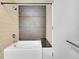 Clean bathroom with a modern bathtub, tiled walls, and contemporary shower fixtures at 891 14Th Street # 1712, Denver, CO 80202