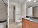 Well-lit bathroom with a modern vanity, toilet, and convenient in-unit laundry area at 891 14Th Street # 1712, Denver, CO 80202