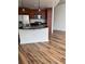 Bright kitchen featuring stainless steel appliances, wooden cabinets, and a black countertop island at 891 14Th Street # 1712, Denver, CO 80202