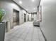 Elegant lobby area with stylish tiled floors, elevator access, and comfortable seating at 891 14Th Street # 1712, Denver, CO 80202