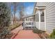 Backyard patio features a gray deck, access to the yard, paver patio with a covered area for entertaining at 13649 Plaster Cir, Broomfield, CO 80023