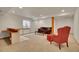 Finished basement featuring carpet, bar area, a comfortable sofa and an accent chair at 13649 Plaster Cir, Broomfield, CO 80023