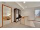 Finished basement featuring a bar, display cabinet and bedroom in the background at 13649 Plaster Cir, Broomfield, CO 80023