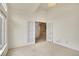Bright room with french doors leading to the main foyer with neutral walls and carpeted floor at 13649 Plaster Cir, Broomfield, CO 80023