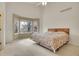 Spacious bedroom with vaulted ceilings, neutral walls, and a large bay window overlooking the yard at 13649 Plaster Cir, Broomfield, CO 80023