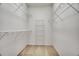 Walk-in closet with carpet and multiple rows of wire shelving for optimal storage at 13649 Plaster Cir, Broomfield, CO 80023