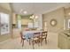 Open concept dining room with chandelier, table, and view of the kitchen and living area at 13649 Plaster Cir, Broomfield, CO 80023