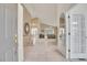 Bright foyer with tile flooring and an open view to the living area at 13649 Plaster Cir, Broomfield, CO 80023