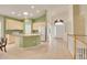Open concept kitchen with an island, lots of cabinets, and an entryway view at 13649 Plaster Cir, Broomfield, CO 80023