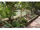Charming landscaping features colorful flowers and a white wooden fence at 13649 Plaster Cir, Broomfield, CO 80023