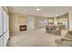 Spacious living room with fireplace, and view into the dining and kitchen areas at 13649 Plaster Cir, Broomfield, CO 80023