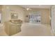 Bright living room with high ceilings, large windows, fireplace, and neutral decor at 13649 Plaster Cir, Broomfield, CO 80023