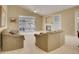 Spacious living room with high ceilings, fireplace, and large windows for natural light at 13649 Plaster Cir, Broomfield, CO 80023