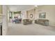 Spacious living room with fireplace, and view into the dining and kitchen areas at 13649 Plaster Cir, Broomfield, CO 80023