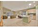Open floor plan with tile flooring, a central fireplace, and comfortable seating at 13649 Plaster Cir, Broomfield, CO 80023