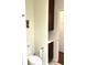 Modern bathroom with toilet, storage cabinets, and neutral decor at 1000 E 1St Ave # 405, Denver, CO 80218