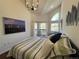 Comfortable bedroom featuring a private balcony and modern artwork at 1000 E 1St Ave # 405, Denver, CO 80218