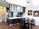 Modern kitchen featuring stainless appliances, sleek countertops, and dining space in an open floor plan at 1000 E 1St Ave # 405, Denver, CO 80218