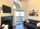 Cozy living room featuring a fireplace, balcony access, and modern decor for comfortable living at 1000 E 1St Ave # 405, Denver, CO 80218