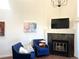 Comfortable living room area with fireplace and modern decor at 1000 E 1St Ave # 405, Denver, CO 80218