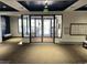 Condo lobby featuring neutral carpet, mailboxes, and a bench at 1000 E 1St Ave # 405, Denver, CO 80218