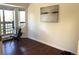 Bright home office featuring hardwood floors, a desk, and bay windows at 1000 E 1St Ave # 405, Denver, CO 80218