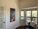Bright home office featuring hardwood floors, a desk, and bay windows at 1000 E 1St Ave # 405, Denver, CO 80218