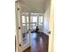 Office with hardwood floors and a chair by the window at 1000 E 1St Ave # 405, Denver, CO 80218