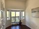 Bright home office featuring hardwood floors, a desk, and bay windows at 1000 E 1St Ave # 405, Denver, CO 80218