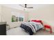 Inviting bedroom with a bed, ceiling fan, and natural light from the window at 5745 S Buchanan Ct # C, Aurora, CO 80016