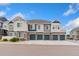 Charming townhome with a blue garage doors and stone accents at 5745 S Buchanan Ct # C, Aurora, CO 80016