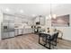 A bright kitchen featuring stainless steel appliances, a stylish dining area, and sleek countertops at 5745 S Buchanan Ct # C, Aurora, CO 80016
