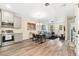 An open floor plan showcases a modern kitchen, cozy living area, and dining space, perfect for entertaining at 5745 S Buchanan Ct # C, Aurora, CO 80016
