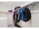 Organized walk-in closet with clothing and storage for shoes and accessories at 5745 S Buchanan Ct # C, Aurora, CO 80016