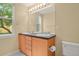 Bathroom with a double vanity, large mirror, and natural light at 8260 E 24Th Dr, Denver, CO 80238