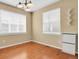 Bright bedroom with hardwood floors, large windows, and a ceiling fan at 8260 E 24Th Dr, Denver, CO 80238